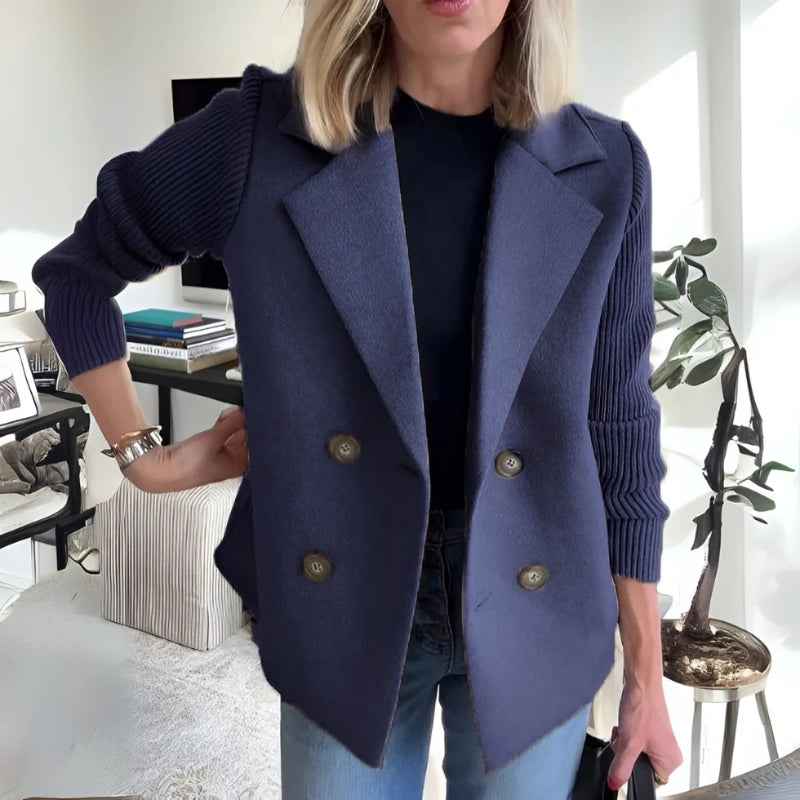 Woman wearing a women's knit sweater blazer with jeans, showcasing its casual chic versatility.