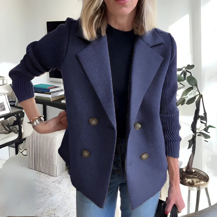 Woman wearing a women's knit sweater blazer with jeans, showcasing its casual chic versatility.