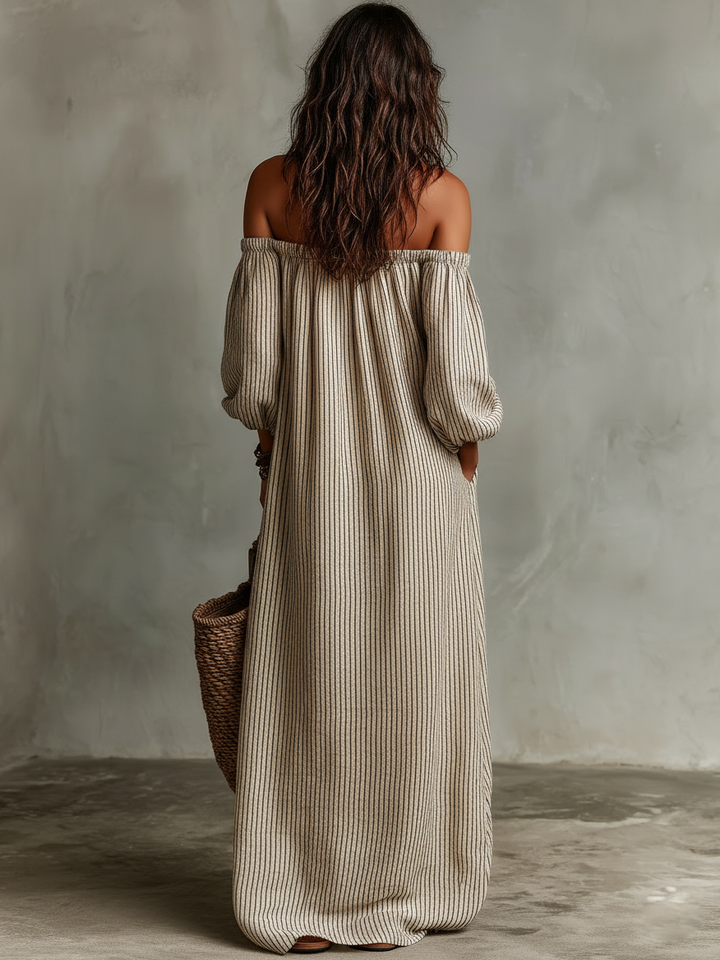 Elegant women's vacation maxi dress with off-shoulder long sleeves, ideal for summer beach outings.