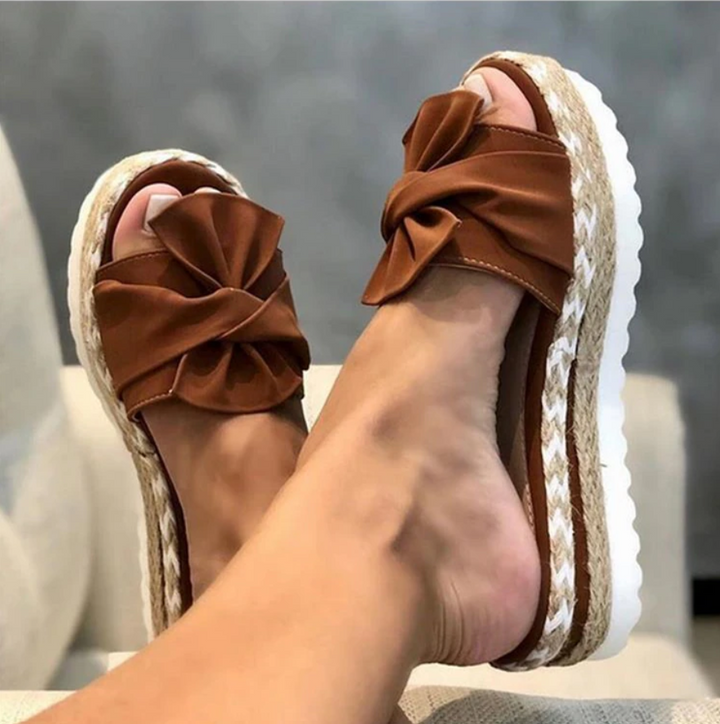 Elegant women's bow sandals featuring orthopedic comfort, sturdy platform, and stylish design for summer fashion.