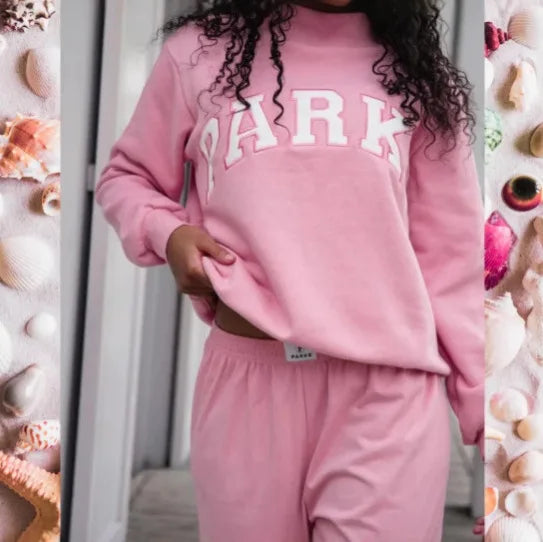 Cozy long sleeve oversized sweater for women, featuring a stylish graphic and ribbed hem.