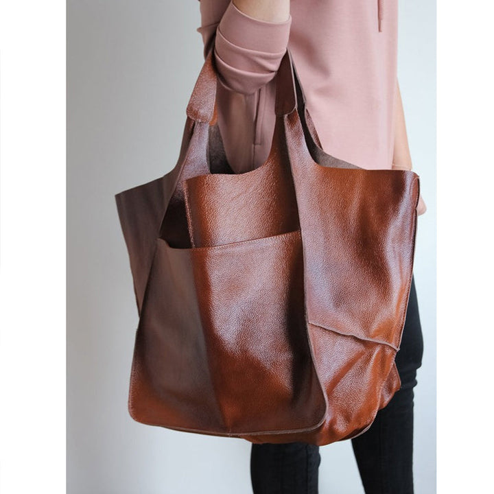 Brown oversized vintage leather shoulder bag for women, a versatile and trendy daily tote.