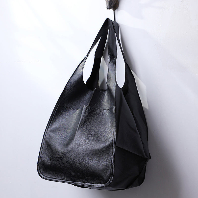 Classic women's oversized vintage leather shoulder bag, a durable travel and daily handbag.