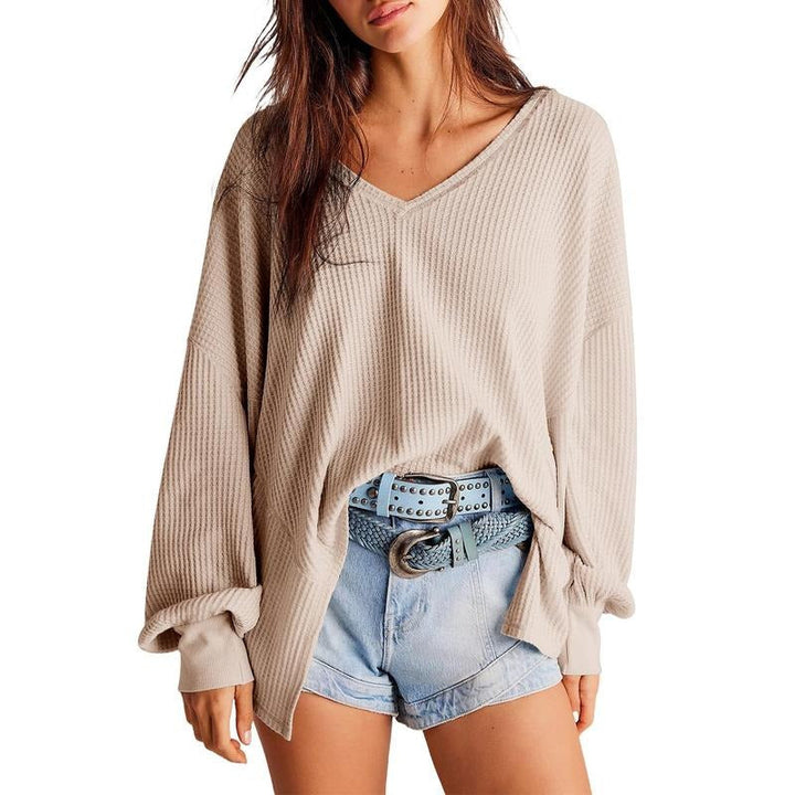 Model wearing a relaxed fit women's V-neck pullover sweater, ideal for everyday casual style
