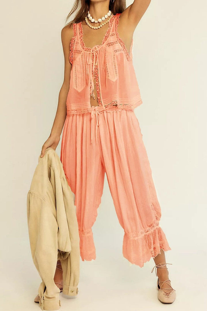 Women's peach two-piece set: cotton top and wide-leg pants with delicate lace trim.