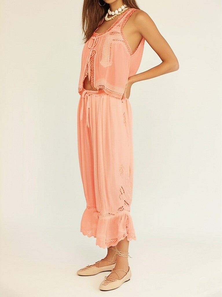 Close-up on lace trim of women's two-piece cotton set in white, highlighting intricate design.