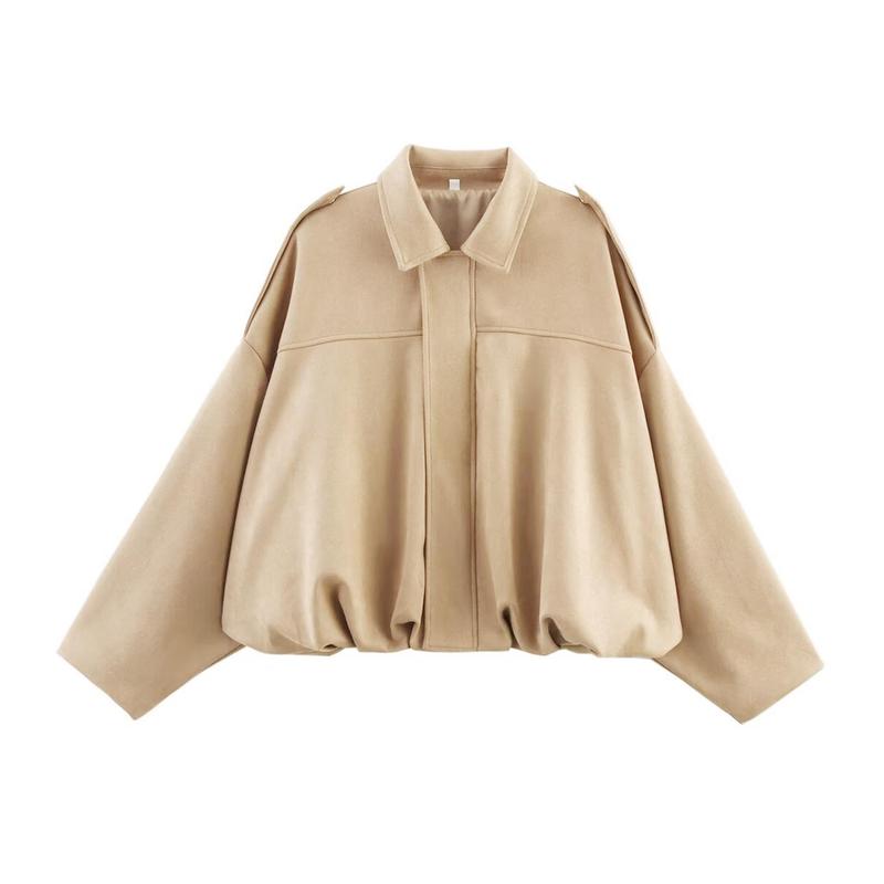 Close-up of a women's beige cropped faux suede bomber jacket with detailed stitching