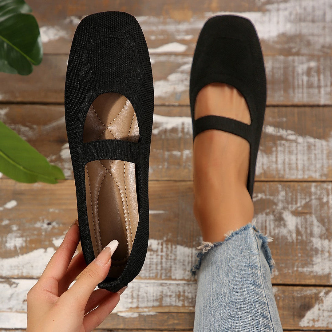 Women's playful yellow Mary Jane ballet flats with cute smiling face detail & adjustable strap, perfect for casual wear.
