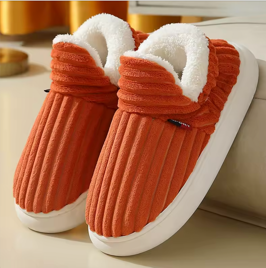 Close-up of women's plush memory foam slipper, showing soft corduroy upper and anti-slip sole
