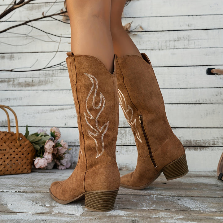 Women's pointed toe cowboy boots with block heel and convenient side zip. Western fashion.