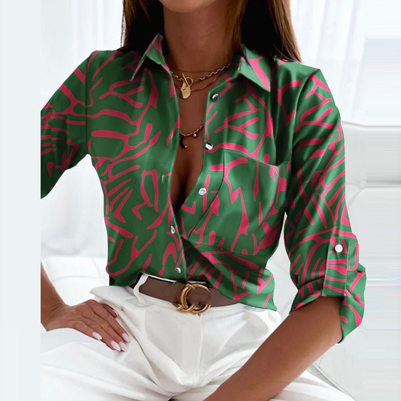 Women's versatile long sleeve button-down blouse in a stylish printed fabric.