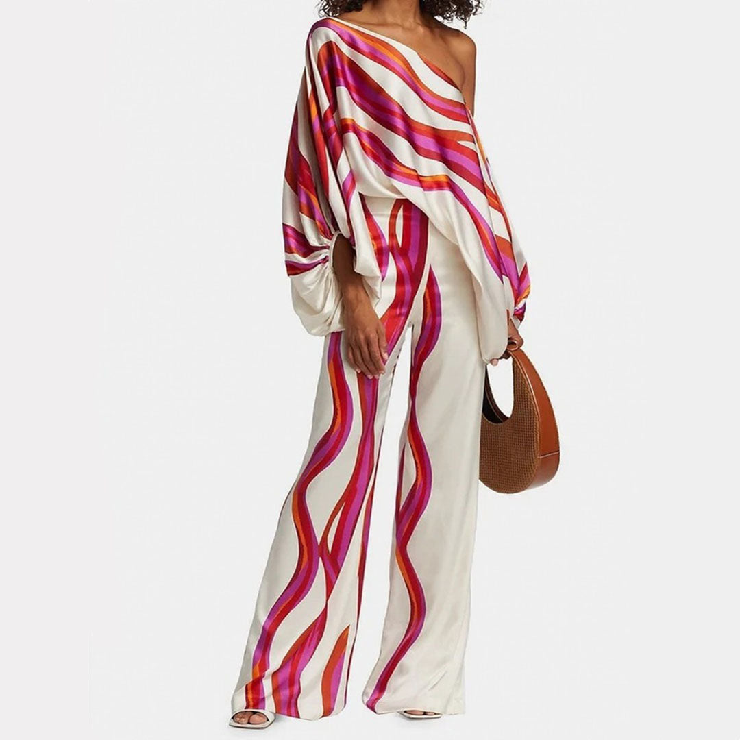Women's printed one-shoulder co-ord set with wide-leg pants. Stylish 2-piece outfit for casual chic vacation wear.
