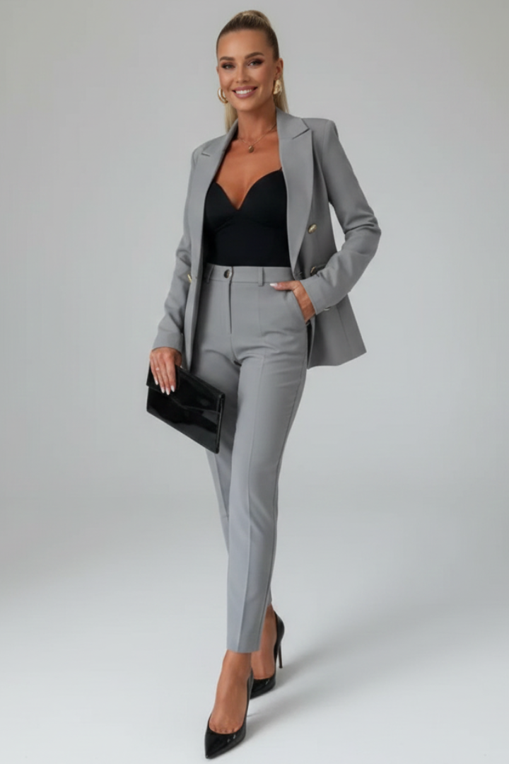 Professional women's suit set. Buttoned jacket & straight leg trousers for formal business wear.