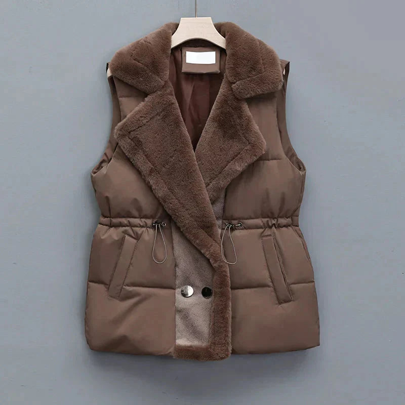 Women's quilted puffer vest with faux fur trim, ideal for winter layering and fashion