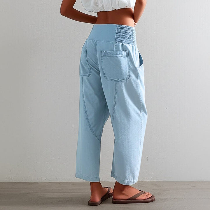 Fashionable women's wide leg pants in a durable yet soft cotton linen fabric, styled casually.
