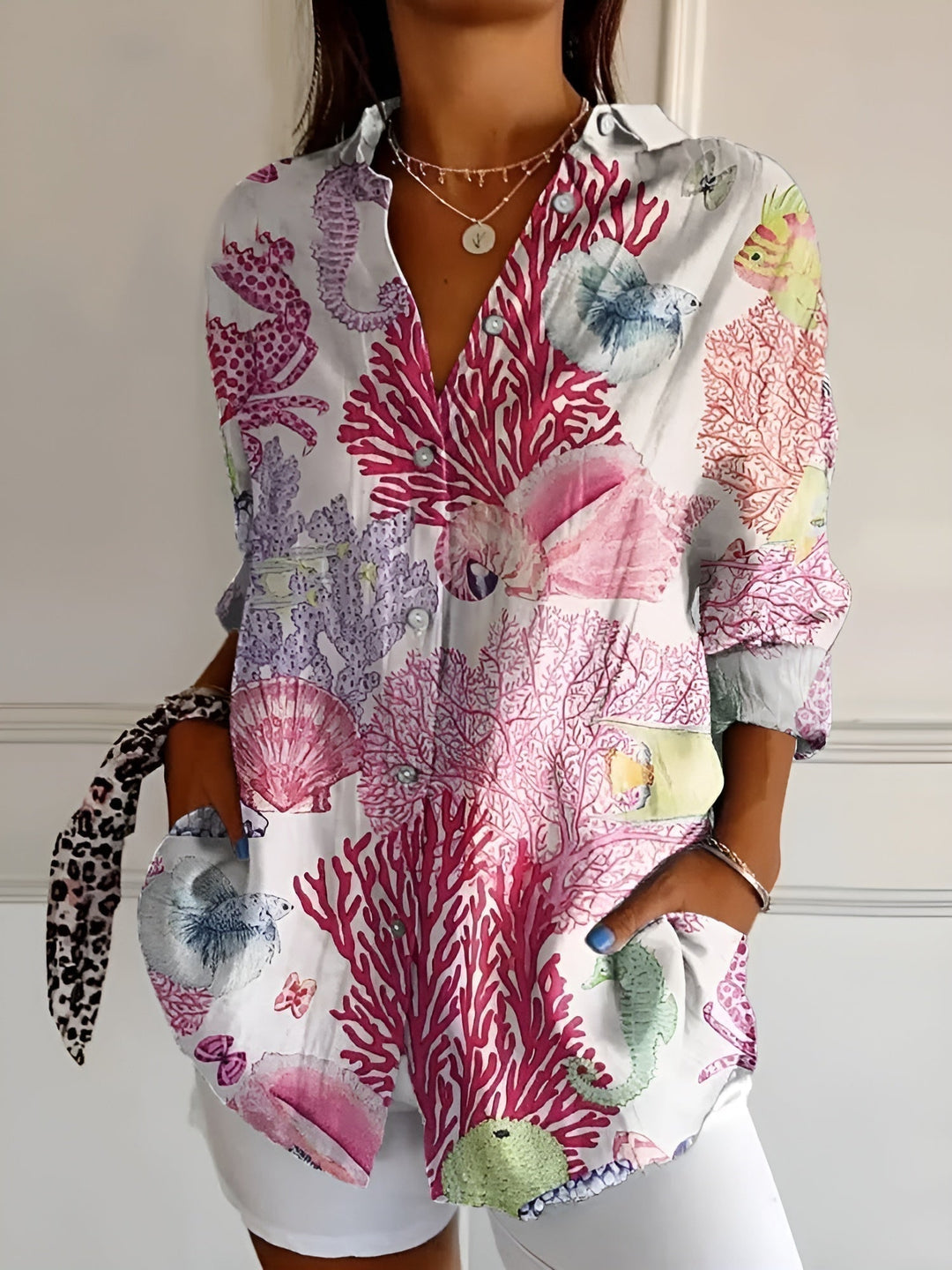 Elegant women's long sleeve button-down blouse, V-neck, relaxed fit. A chic top for office or casual styling.