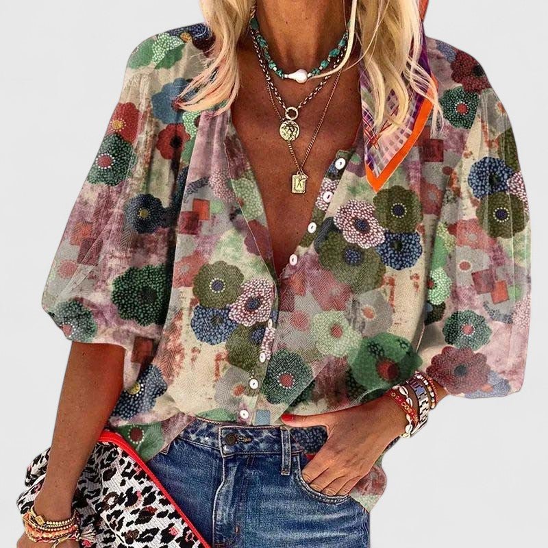 Women's relaxed fit green floral V-neck blouse with button front, ideal for casual spring & summer style.