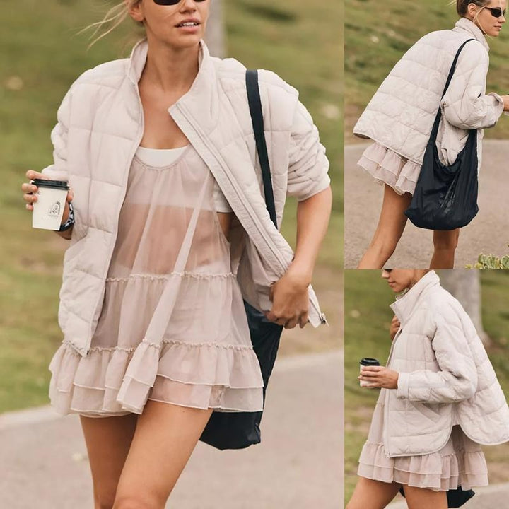 Women's relaxed fit quilted puffer jacket in a neutral color, perfect for fall fashion and warmth.