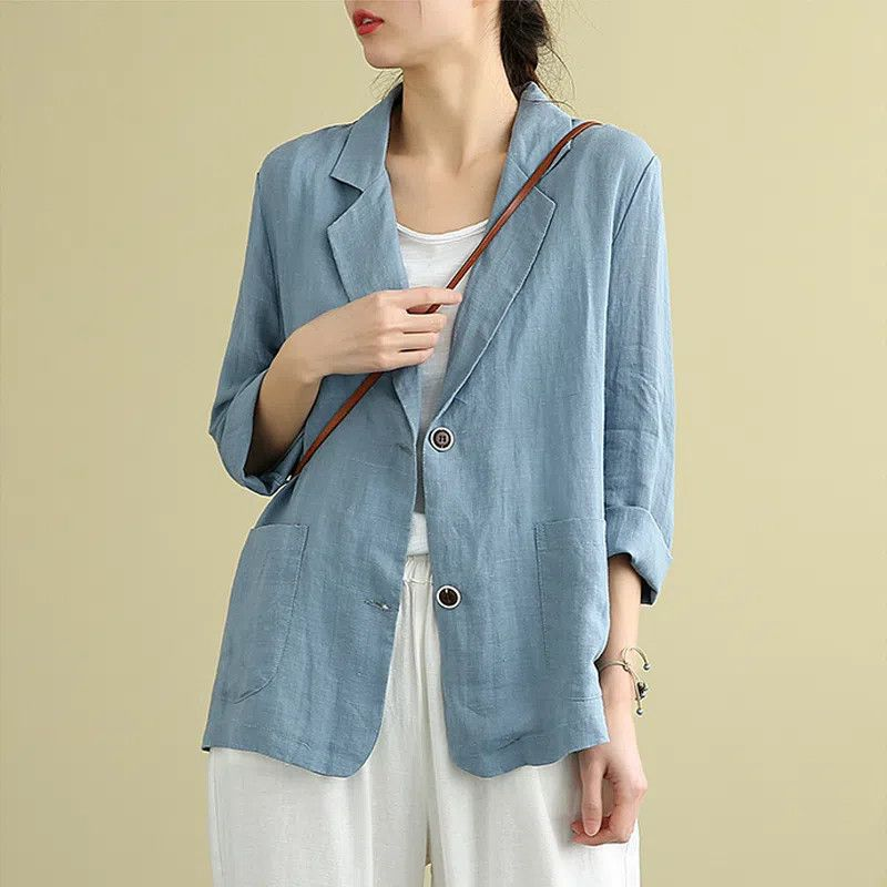 Women's relaxed fit single-breasted blazer in a lightweight fabric, perfect for smart casual office wear or spring fashion.