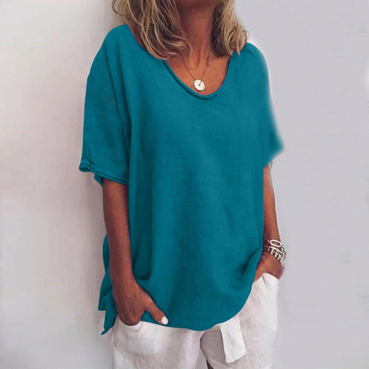 Chic women's V-neck top, relaxed fit, elbow-sleeve blouse. Great for spring and summer casual wear. Effortless style.