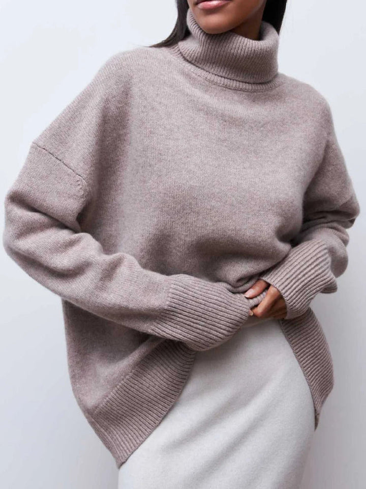 Soft merino blend oversized turtleneck sweater for women, a stylish and warm long sleeve top for winter.