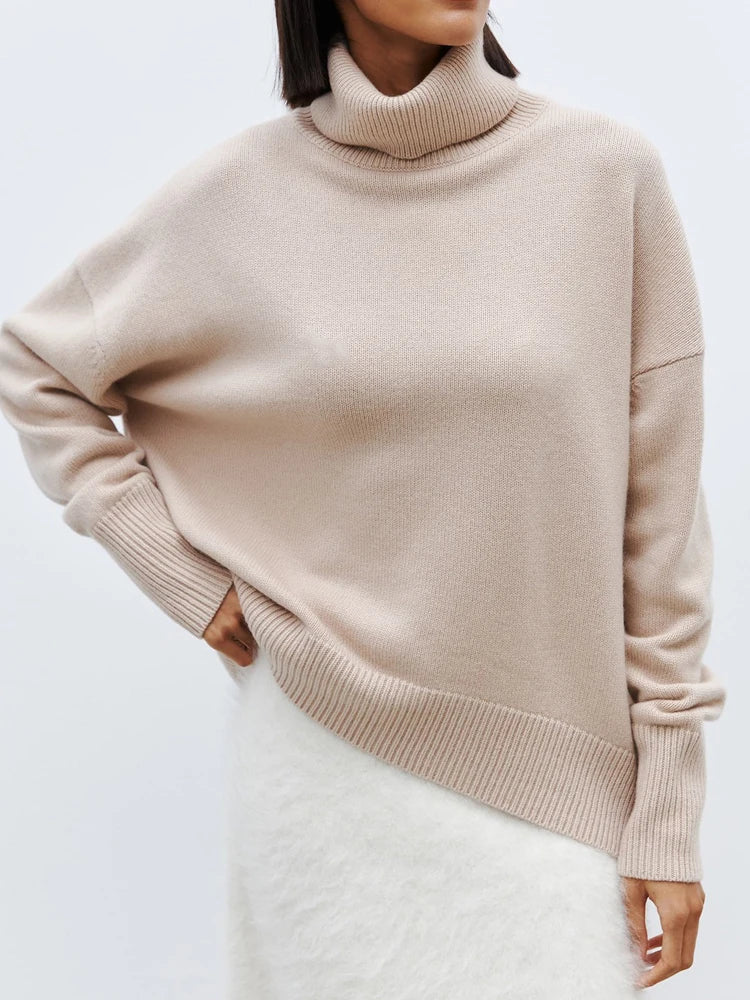 Warm women's relaxed fit merino blend turtleneck sweater, a versatile addition to any winter wardrobe.