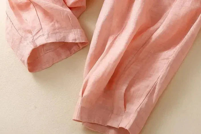 Versatile women's linen trousers with a relaxed tapered leg, a must-have for summer wardrobes.