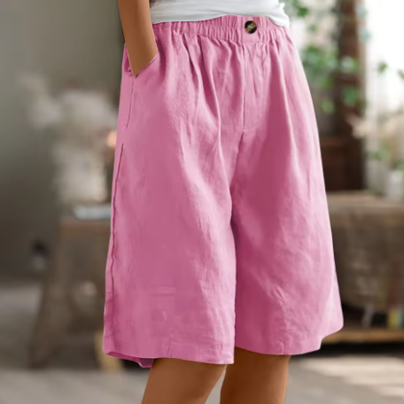 Side view of women wearing relaxed fit wide leg Bermuda shorts, highlighting the comfortable, airy silhouette.
