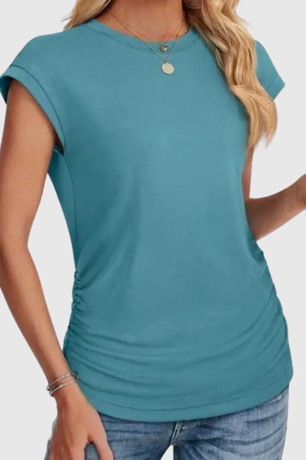 Soft women's loose fit tunic, ruched side, short ruffle sleeves. Comfortable and stylish for casual outings.