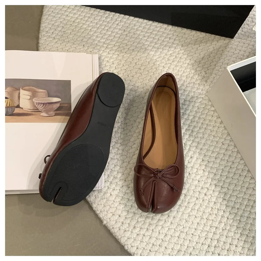 Beige slip-on ballet flats for women, crafted from soft leather with a classic design