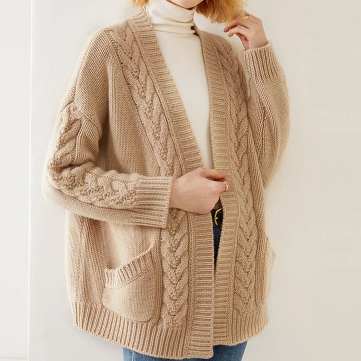 Close-up of the luxurious texture of a women's cashmere blend knit open cardigan, highlighting its softness.