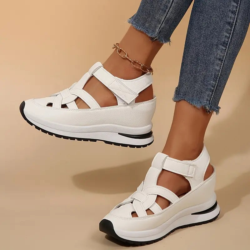 Stylish women's open-toe platform sandals. Features a trendy cutout design and adjustable straps.