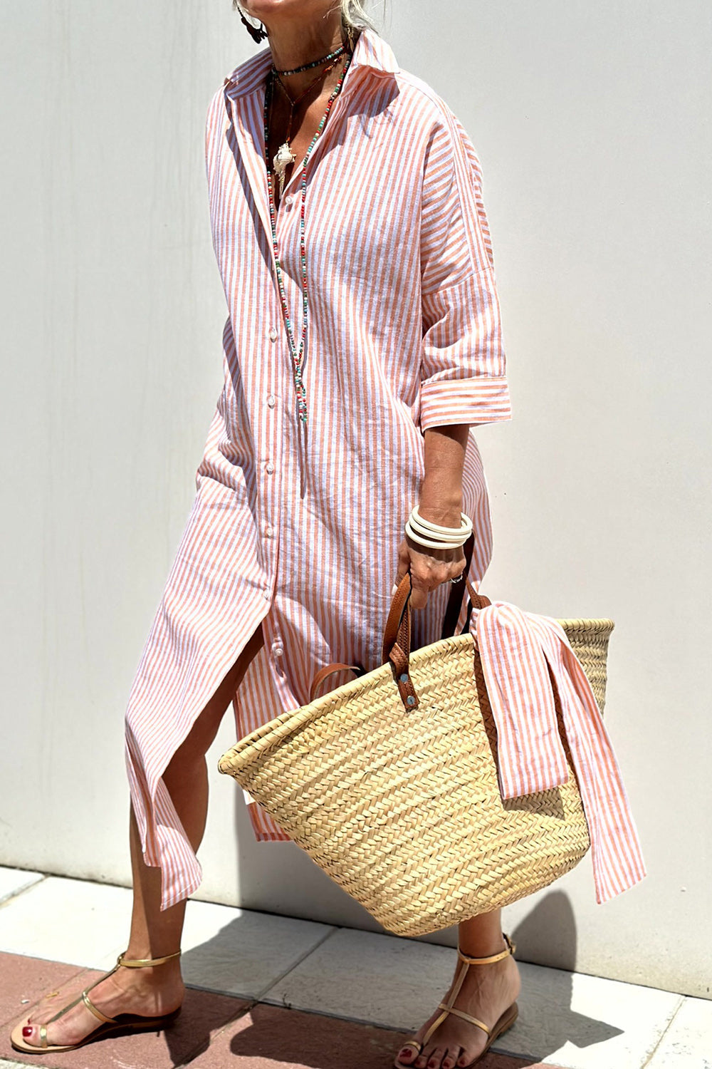 Women's striped collared button-down oversized midi dress in a relaxed fit, perfect for casual day wear.