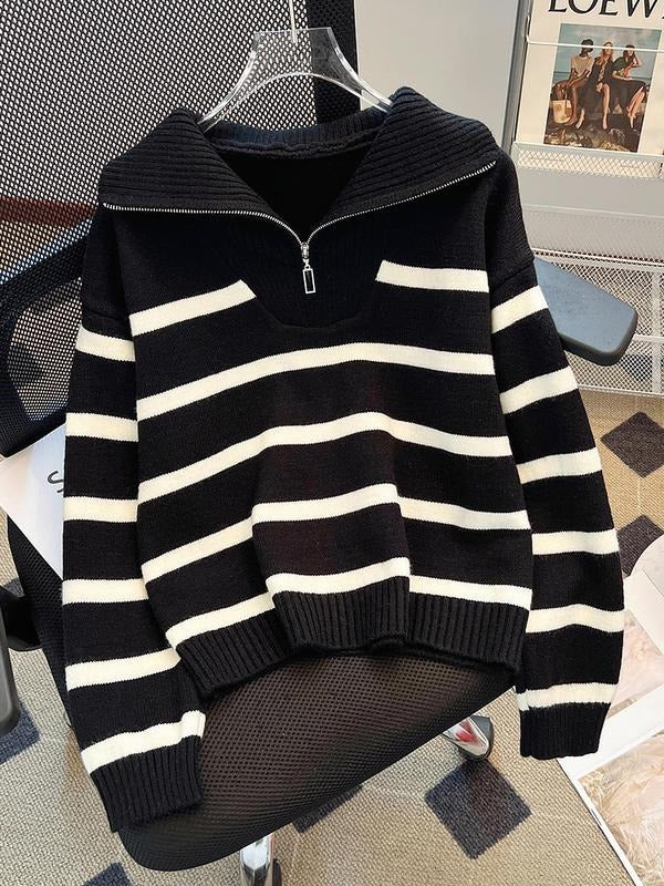 Close-up of the striped pattern and half-zip detail on women's knit sweater
