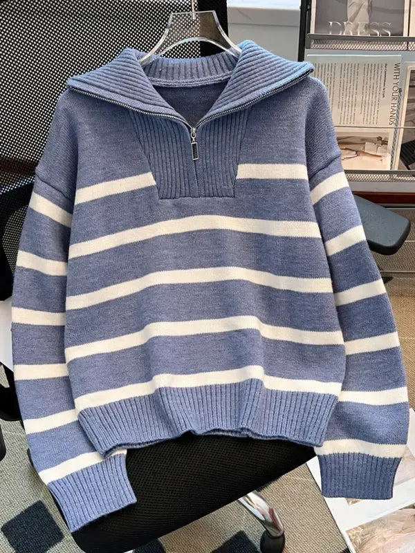 Stylish woman wearing a long sleeve striped knit half-zip pullover sweater