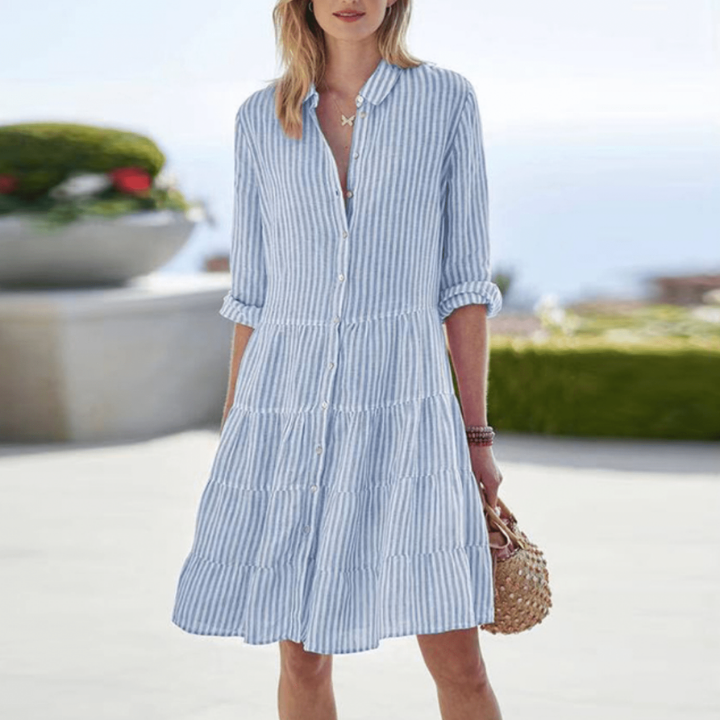 Fashionable women's striped tiered button-down mini dress. Comfortable 3/4 sleeve casual summer day dress.