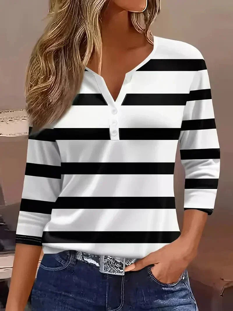 Modern women's striped V-neck shirt. Effortless short sleeve top, ideal for summer and everyday fashion.