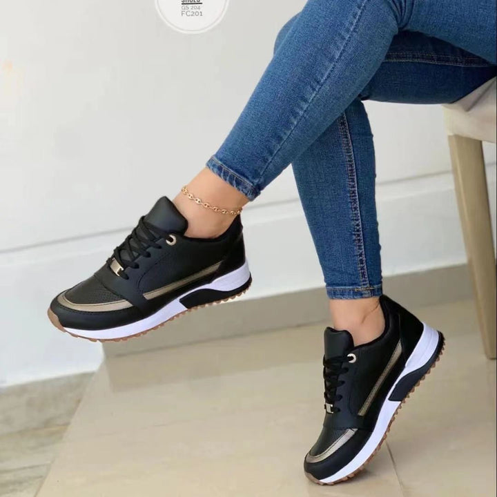 Comfortable women's gold trim platform sneakers with lace-up front, ideal for trendy casual fashion.
