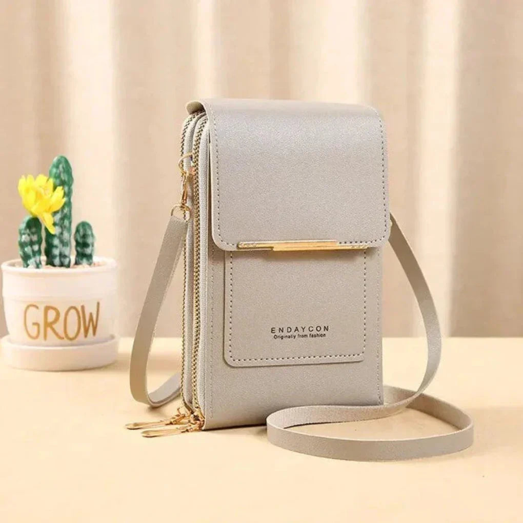 Everyday women's crossbody phone purse. Touch screen accessibility for convenient smartphone use on-the-go.