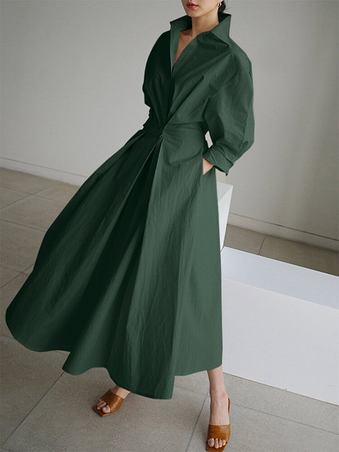 Women's V-neck A-line midi dress with convenient pockets, perfect for casual elegant style.