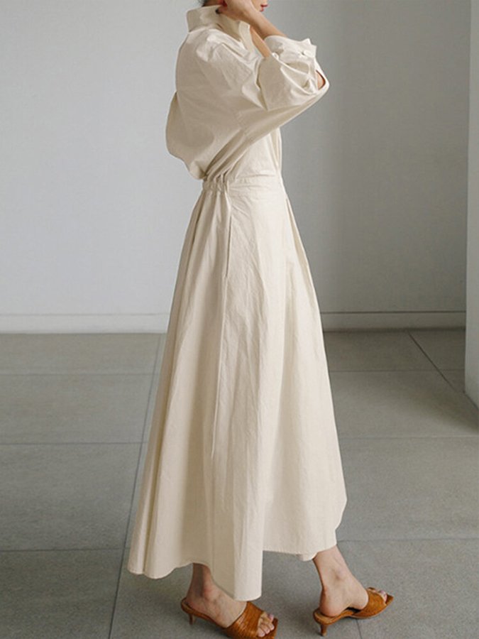 Women's V-neck A-line midi dress. Casual elegant, versatile, with practical pockets.