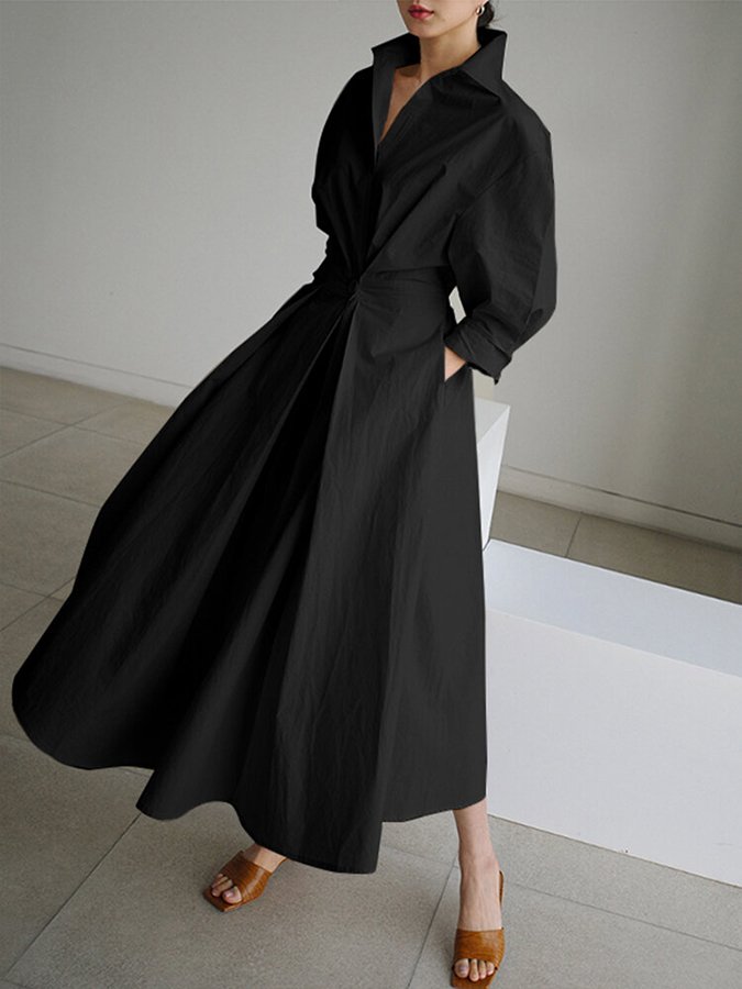 Stylish women's V-neck A-line midi dress, comfortable for any occasion, featuring handy pockets.