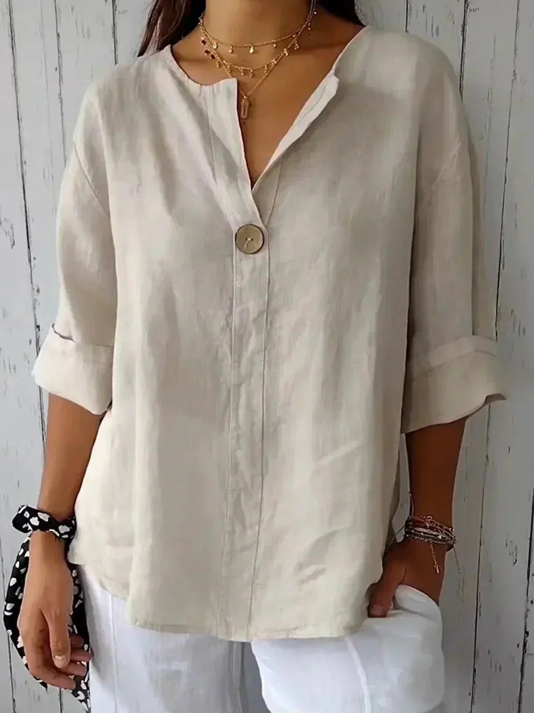 Classic style women's V-neck blouse with roll-tab sleeves, perfect versatile top for spring & summer fashion.