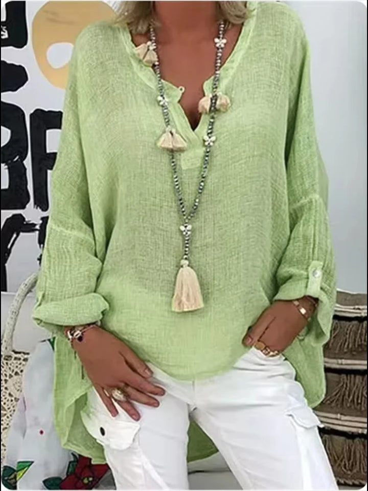 Casual women's V-neck long sleeve blouse featuring roll-tab sleeves & a comfortable relaxed fit top.