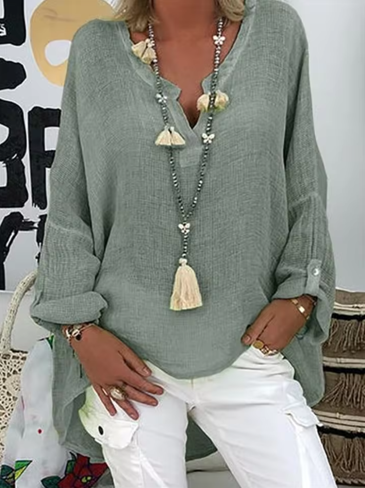 Women's V-neck long sleeve blouse, relaxed fit, roll-tab sleeves. A versatile, casual fashion top.
