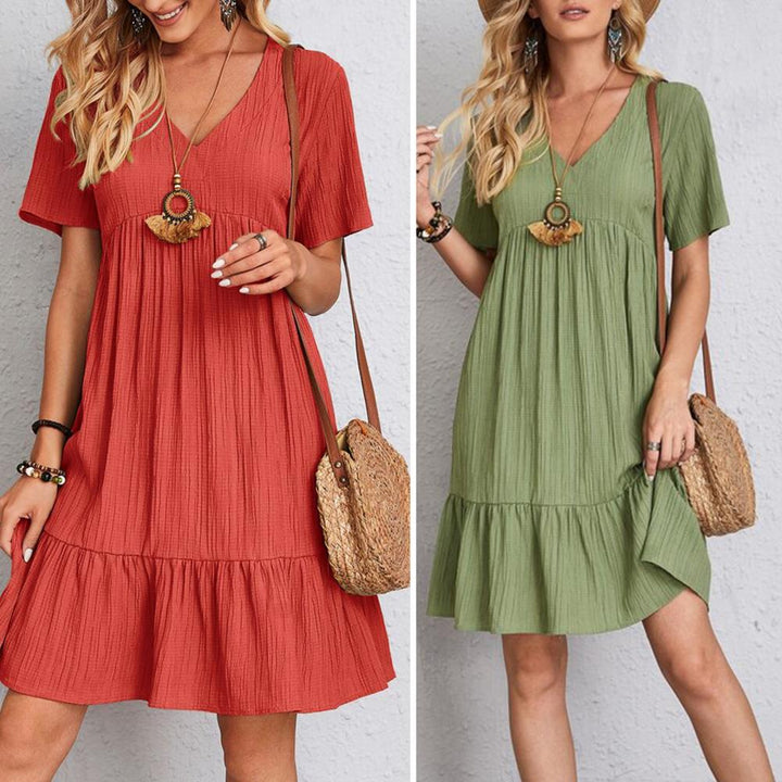 Women's V-neck tiered mini dress. Effortlessly stylish & comfortable short sleeve design for summer.