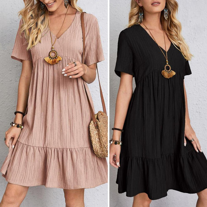 Comfortable V-neck tiered mini dress. Women's short sleeve summer dress, stylish & versatile for casual wear.