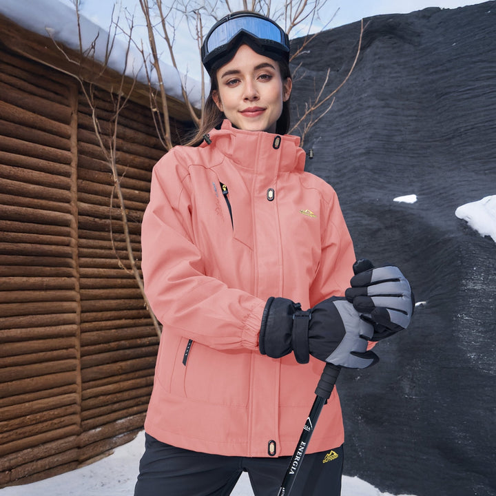 Verona 3-in-1 women's waterproof jacket, black, paired with hiking boots, ready for outdoor adventures.