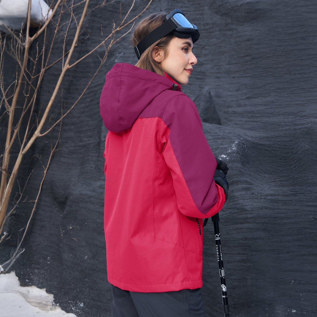 Woman reaching into a pocket of her Verona 3-in-1 waterproof jacket, functional outdoor wear.