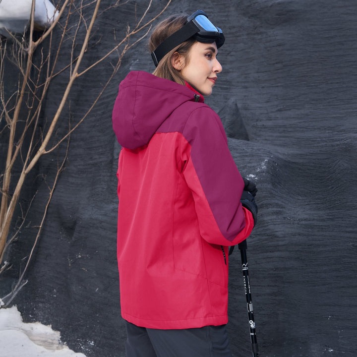 Woman reaching into a pocket of her Verona 3-in-1 waterproof jacket, functional outdoor wear.